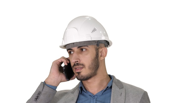 Engineer talking a mobile phone inspecting construction