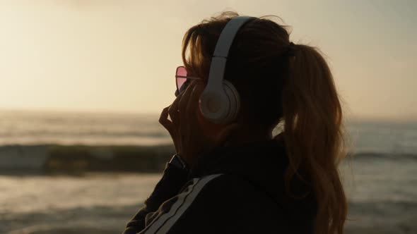 Listening To Music On The Beach