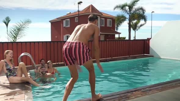 Young people having fun in exclusive pool party