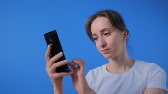 Woman Using Smartphone, Having Video Chat, Interview or Consultation at Home