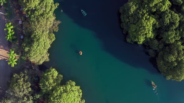 AERIAL: Lago De Camecuaro, Boat, Swimmer, Tangancicuaro, Mexico (Passing Down)