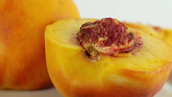 Rotation of a juicy peach. 360 degree rotation, extreme close-up. Peach orange juicy tree fruit.