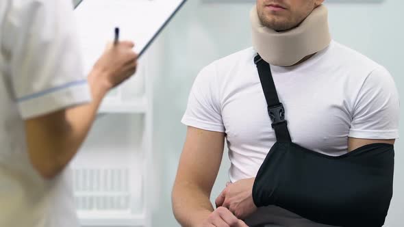 Upset Male in Foam Cervical Collar and Arm Sling on Doctors Appointment, Result