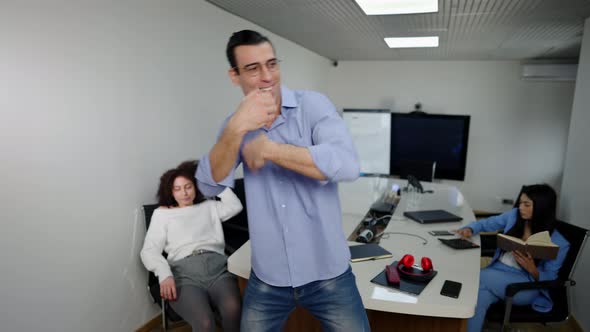 Funny Joyful Middle Eastern Man Dancing in Office