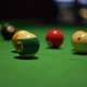 Kicking of Balls with Pool Stick on Table with Green Fabric - VideoHive Item for Sale