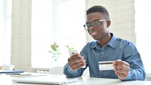 Successful Online Payment on Phone by Young African Man 