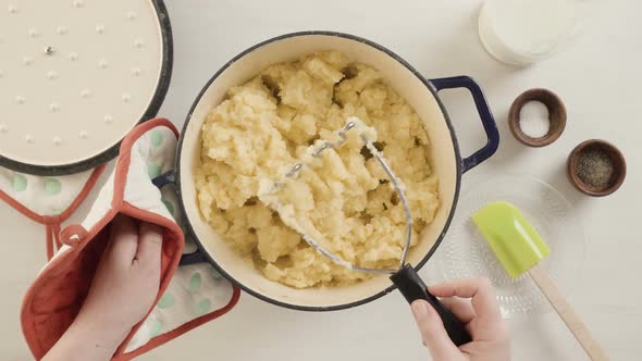 Step by step. Preparing classic mashed potatoes for Thanksgiving dinner.