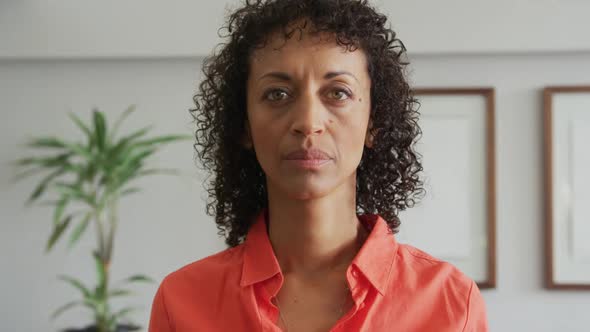 Close-up of African american woman looking at camera in the lobby at hospital 