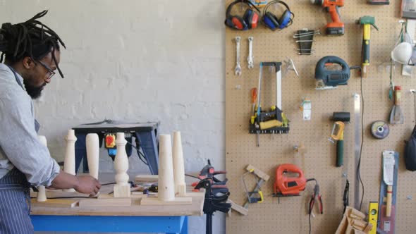 Carpenter preparing wooden column 4k