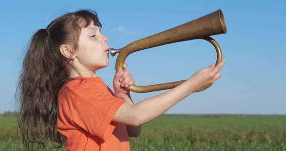 Kid with a pipe in the fresh air.