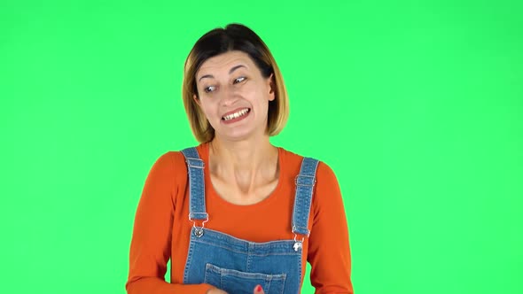 Woman Disappointed Looks in Camera Bites Her Lip Then Shrugs. Green Screen