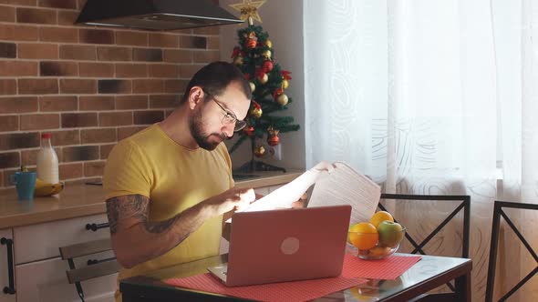 Tired Man Work at Home with Laptop