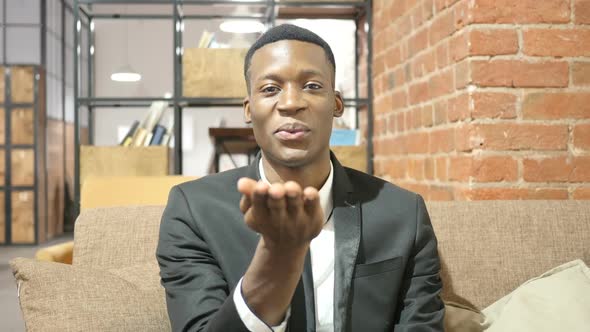 Flying Kiss by Black Businessman, Indoor