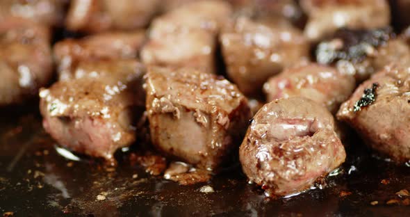 The Fried Liver with Oil Bubbles Rotates Slowly 
