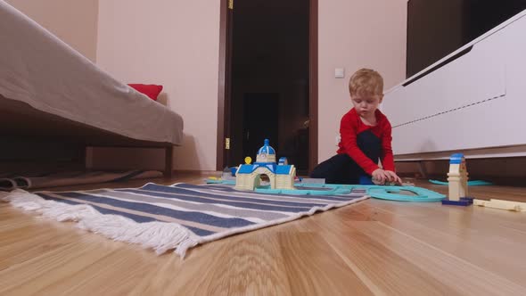 Kid Playing With Toy Cars