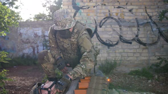 Ranger Dragging Away Fallen Soldier From Combat