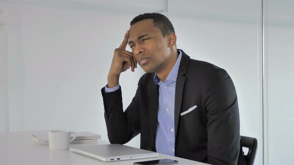 Depressed Casual Afro-American Businessman Thinking at Work, Brainstorming