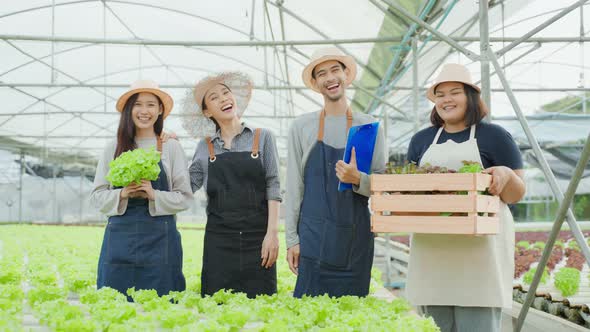 Portrait Group of Asian farmers worker in vegetables hydroponic farm.