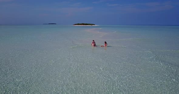 Happy boy and girl married on vacation spend quality time on beach on paradise white sand background