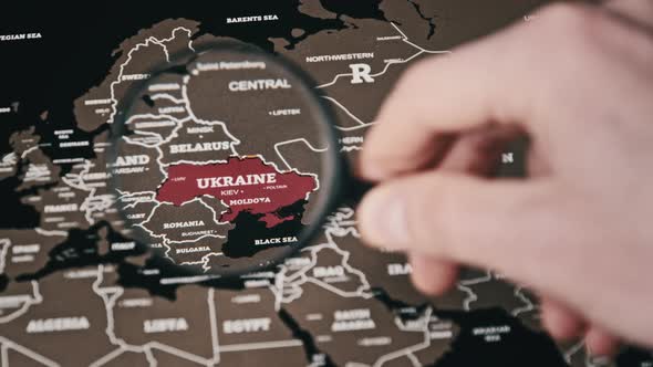 Ukraine on the World Map Under Magnifying Glass