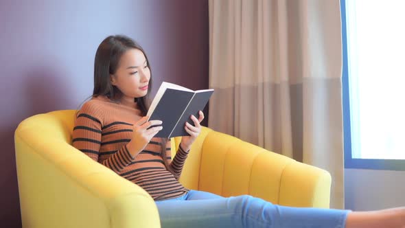 Young asian woman read book