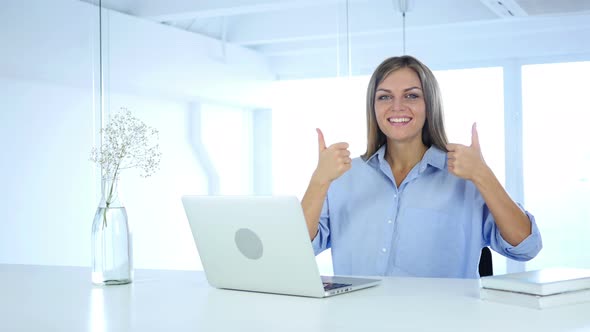 Thumbs Up Gesture by Woman at Her Work