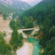 Aerial View of bridge above the Bhagirathi river surrounded by green pine forest in Harshil - VideoHive Item for Sale