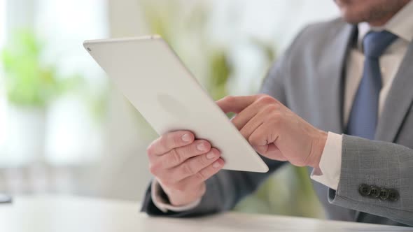 Close Up of Businessman Using Digital Tablet