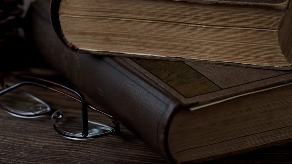 Books and glasses on wooden table