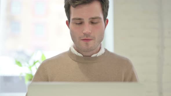 Close Up of Man Talking on Video Call on Laptop