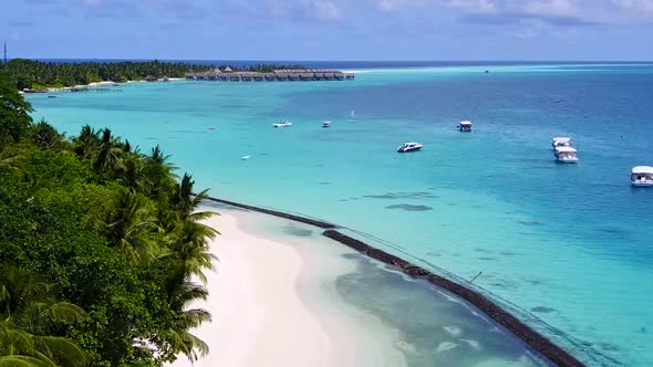 Aerial drone seascape of seashore beach break by clear sea with sand background