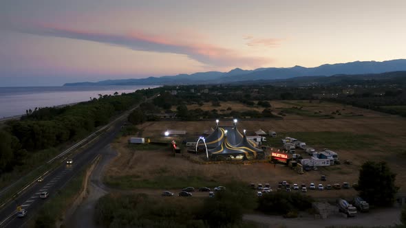 Big Top of a Circus with Caravans in a Field