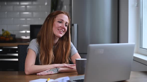 A Young Woman Is Using Laptop for Video Call