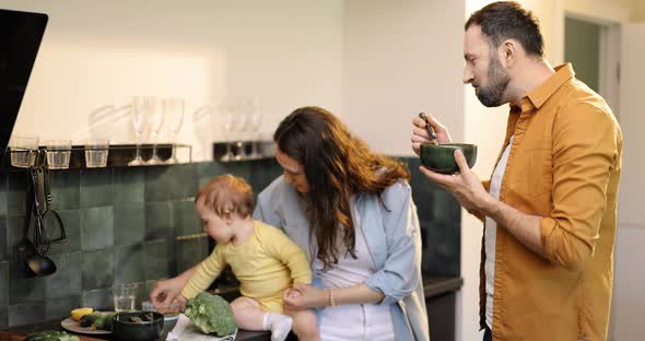 Family with a Baby on the Kitchen