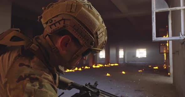 Modern Warfare Soldier in Action Near Window Changing Magazine and Take Cover