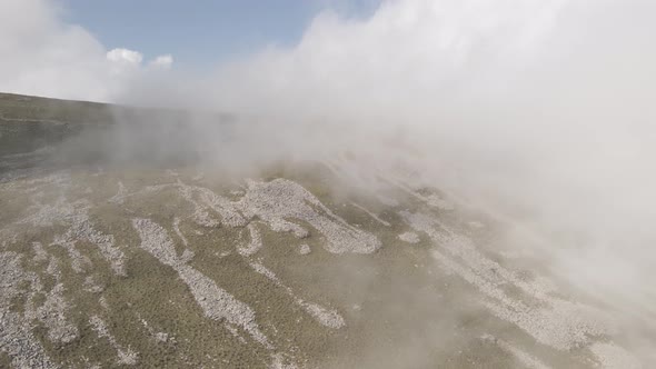 Scenic aerial view of moving white clouds at Abuli Mountain. Georgia