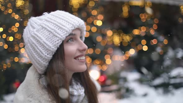 Close Up of Girl Enjoying Snowfall on the Street