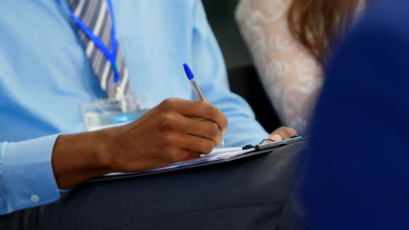 Business people writing on notepad in the business seminar 4k