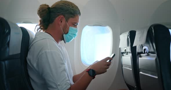 Caucasian Guy in the Blue Medical Mask Traveling During Pandemic