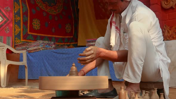 Potter at Work Makes Ceramic Dishes