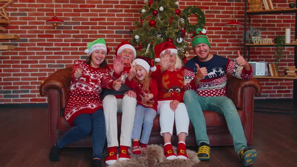 Girl Set Timer on Mobile Phone Taking Multigenerational Family Selfie Portrait Celebrating Christmas