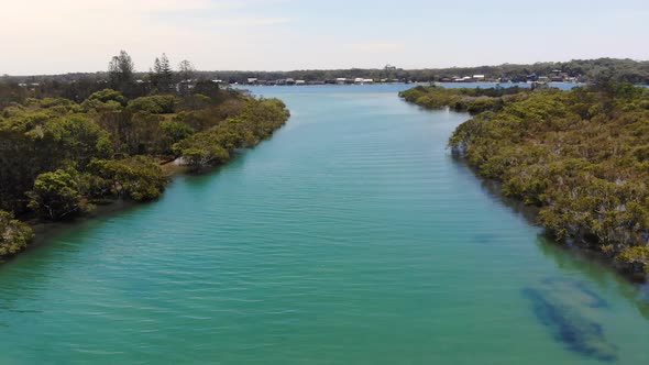 Beautiful Aerial View of Green Clear Water of the Hastings river and Forest at the Woregore Nature R