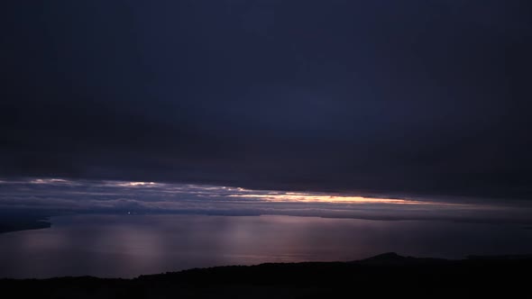 Time lapse view of twilight fading to night over a tranquil lake