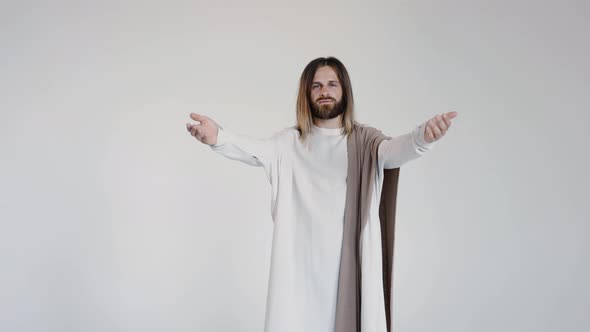 Jesus in Robe Spreads His Hands to the Sides Calling for Prayer