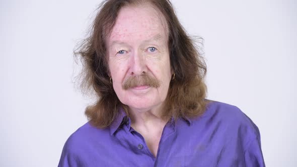 Senior Man with Mustache Wearing Purple Silky Shirt