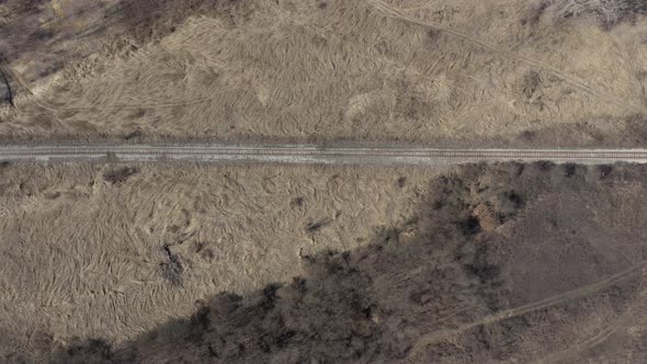 Slow descending on abandoned railroad track 4K aerial video