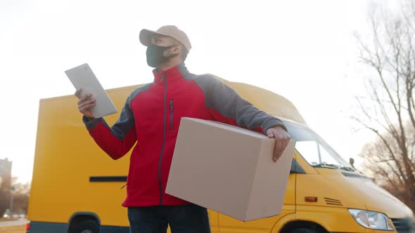 Man with Face Mask Delivering Package