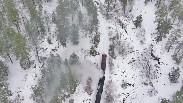 Top Down Aerial Shot of Railway Train in Snow Covered Forest Trees  Colorado