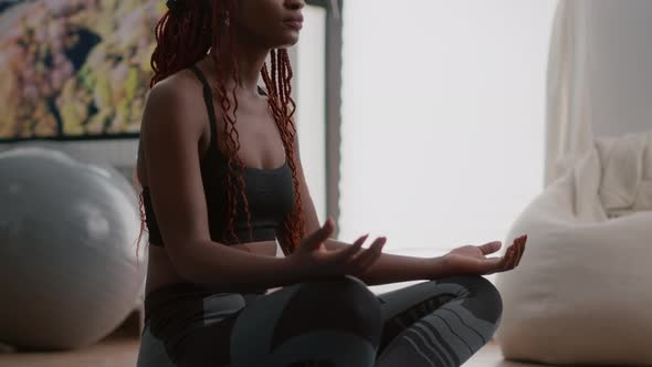 Athlete Woman with Black Skin in Sportwear Practicing Yoga at Home