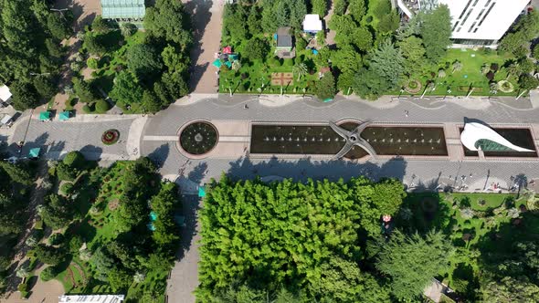 Aerial view of wedding palace and fountains near Technological university tower